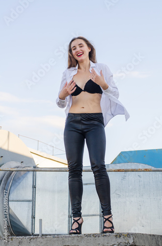 Young sexy woman posing in the roof, Lifestyle portrait