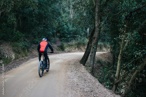 Mountain Bike cyclist riding single track © Marta