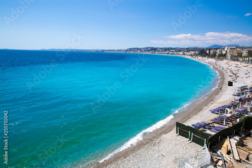 Nice, beautiful beach, French Riviera, Cote d'Azur or Coast of Azure. Bright turquoise water. 