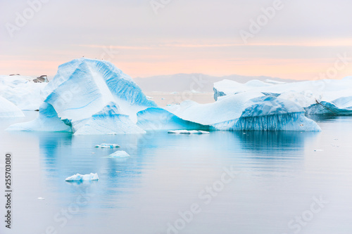 Blue icebergs in Atlantic ocean in Greenland