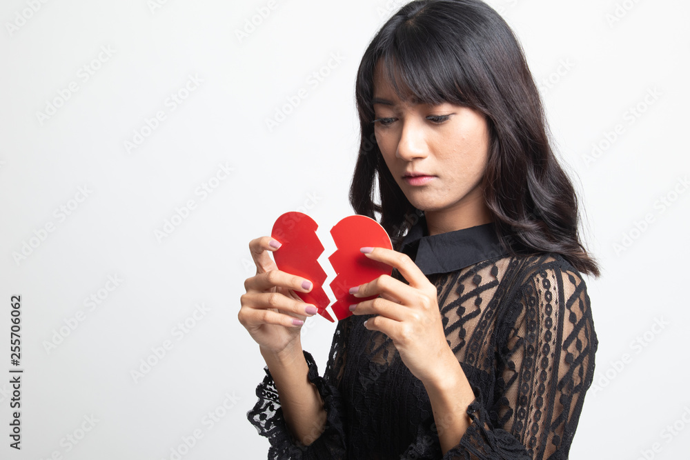 Beautiful young Asian woman with broken heart. Beautiful young Asian woman with broken heart.