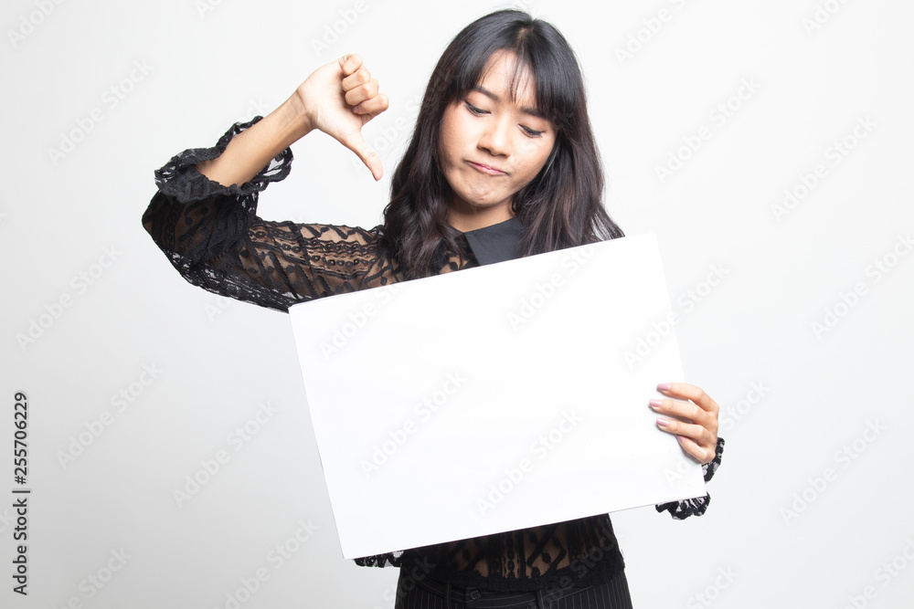 Young Asian woman show thumbs down with white blank sign. Young Asian woman show thumbs down with white blank sign.
