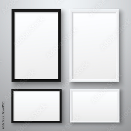White and black realistic empty pictures frame on gray background. A4 vertical and horizontall blank picture frames for photographs. Vector illustration photo