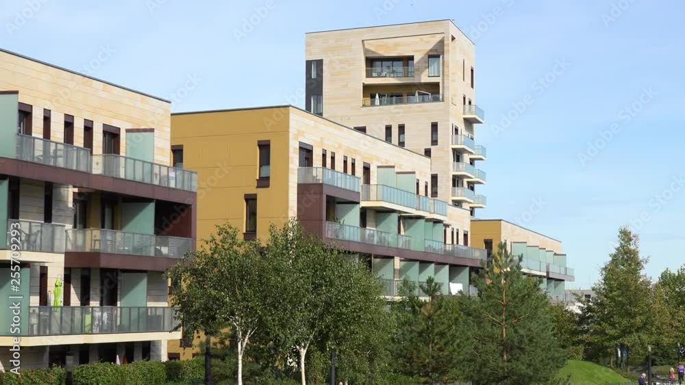 Apartment buildings with interesting design in an urban area - the clear blue sky in the background Apartment buildings with interesting design in an urban area - the clear blue sky in the background