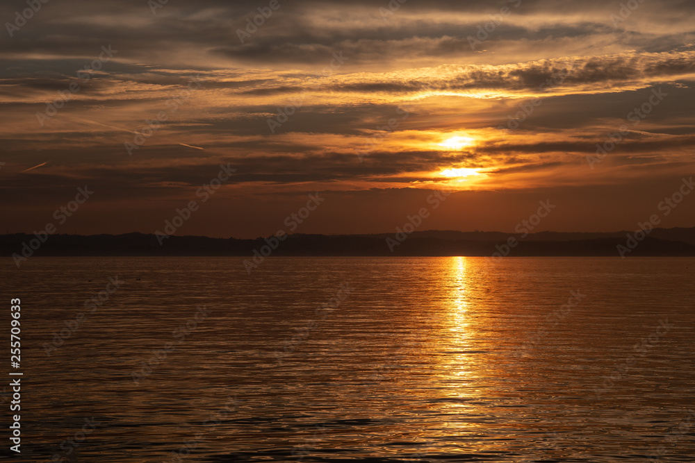 Golden sunset on Lake Garda, Sirmione, Lombardy, Italy Golden sunset on Lake Garda, Sirmione, Lombardy, Italy