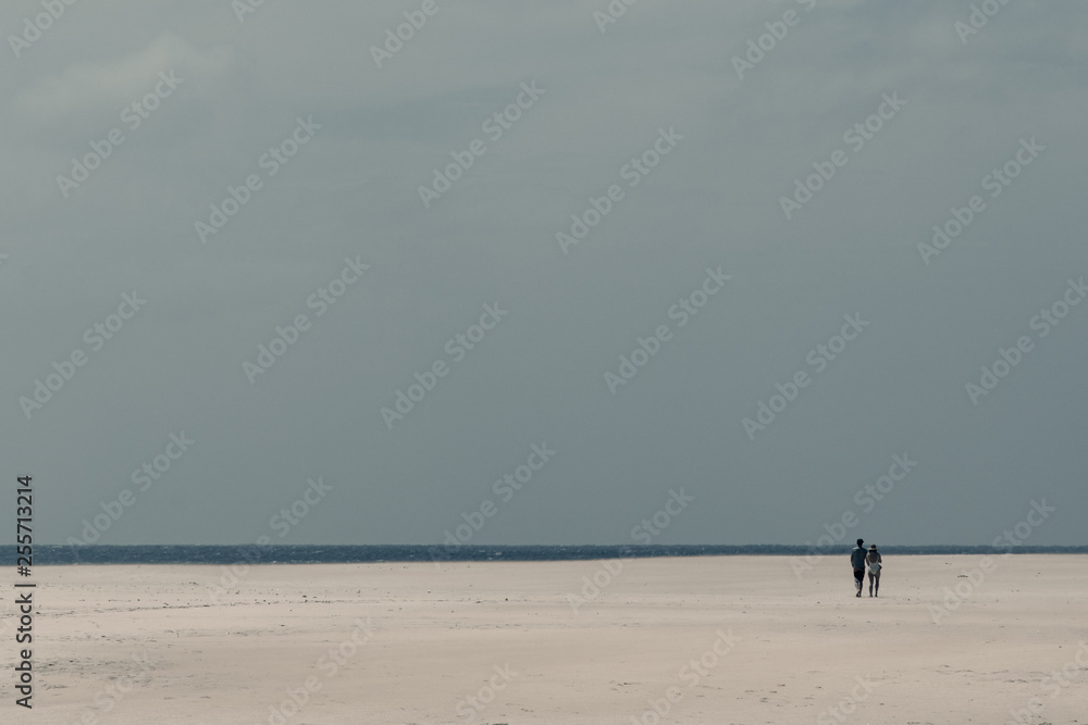 minimalistic beach scene with two persons 