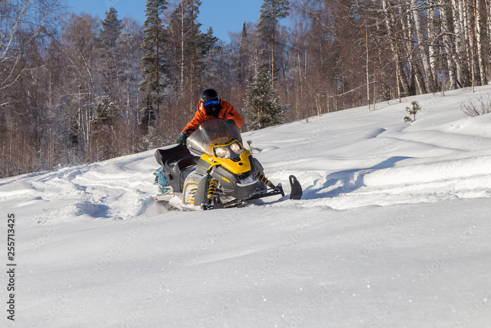 Athlete on a snowmobile.