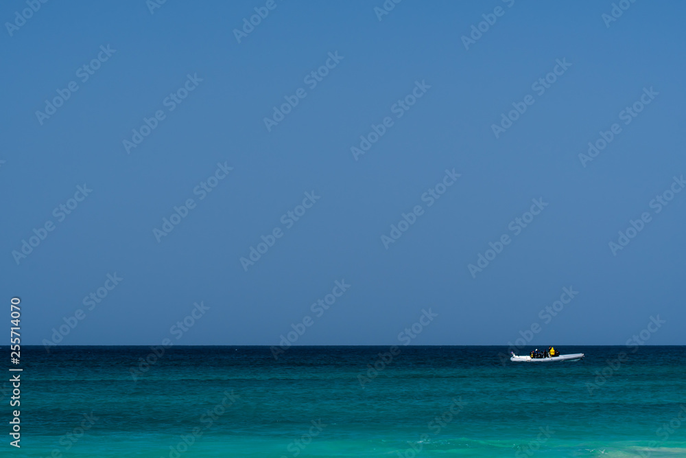 life guard with boat on the water