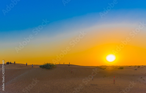 Jeep Safari at sunset over sand dunes in Dubai Desert Conservation Reserve...