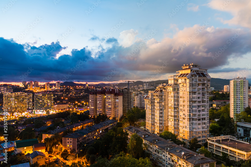 Time-lapse collage of day to night transition. Aerial view of the apartment district of the city of Sochi, Russia