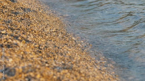 Wallpaper Mural Detail of sea waves coming to seashore, beach with gravel, peaceful view  Torontodigital.ca