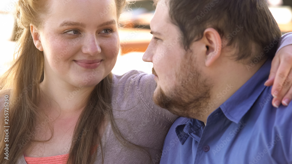 Positive couple of beloved embracing, happy overweight family, soulmates closeup Positive couple of beloved embracing, happy overweight family, soulmates closeup