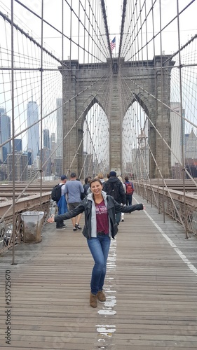 hot sexy young woman breathtaking on brooklyn bridge in new york