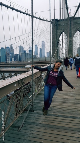 hot sexy young woman breathtaking on brooklyn bridge in new york