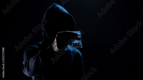 Принти на полотні Person holding bag with dangerous toxic pills, drug dealer, addiction problem