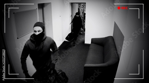 Undefined thieves escaping from place of crime, armed robbery, CCTV effect