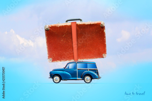 Blue old cars with a suitcase on the trunk. On a blue background. Travel concept. Summer