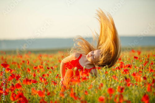 Child in a field with flowers