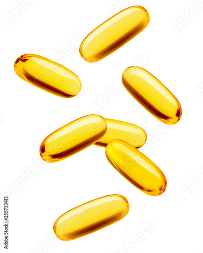Falling Fish oil pill, omega 3, isolated on white background, clipping path, full depth of field photo