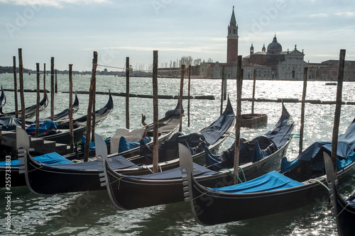 Gondolas moored at Piazza San Marco in Venice © giamplume