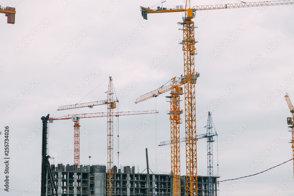 Construction of modern high-rise buildings. Phased construction of structures in winter. Construction of modern high-rise buildings. Phased construction of structures in winter.
