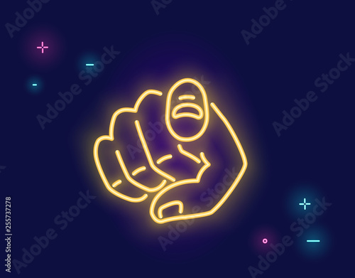 We want you human hand with the finger pointing or gesturing towards you in neon light style isolated on dark purple background photo