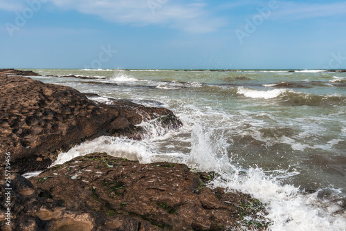 Splash of waves on a rocky seashore