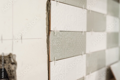 Process of laying ceramic tiles, construction and repair in the kitchen, tiles