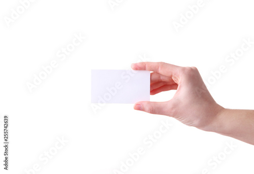 Woman holding white business card in hand isolated on a white background.