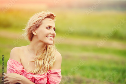 outdoor portrait of a beautiful middle aged blonde woman