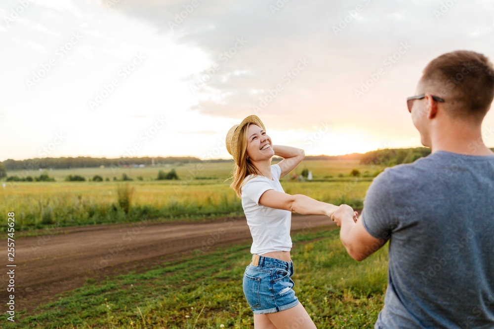 Young couple relax and have fun in nature on a Sunny summer day Young couple relax and have fun in nature on a Sunny summer day