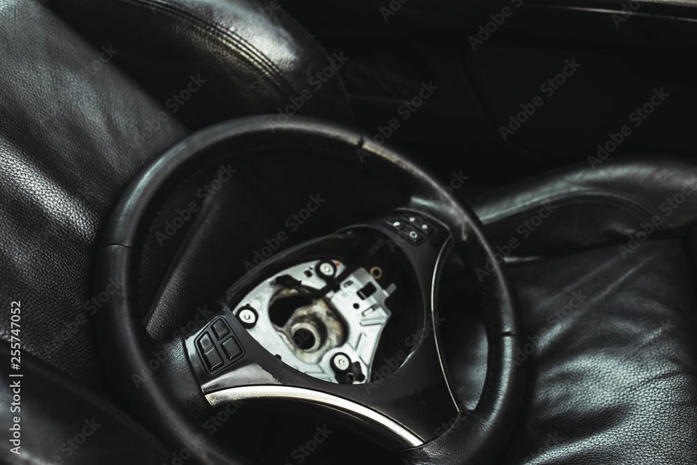 repair of the steering mechanism of the car. Replacing the steering wheel in a sports car. safety bag. repair of the steering mechanism of the car. Replacing the steering wheel in a sports car. safety bag.