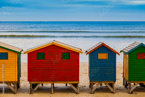 Colorful bathing huts in Muizenberg beach, in front of the ocean sea, Cape Town, South Africa © SimoneGilioli