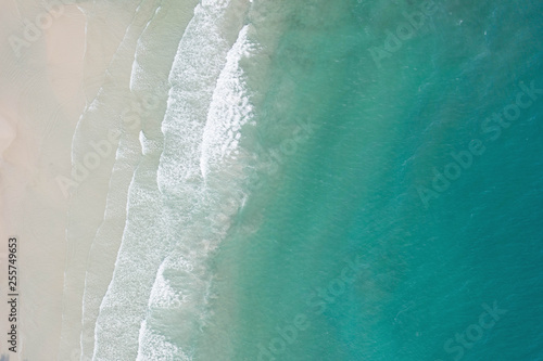 Aerial view, tropical beach, top view of the waves on the beautiful sand beach