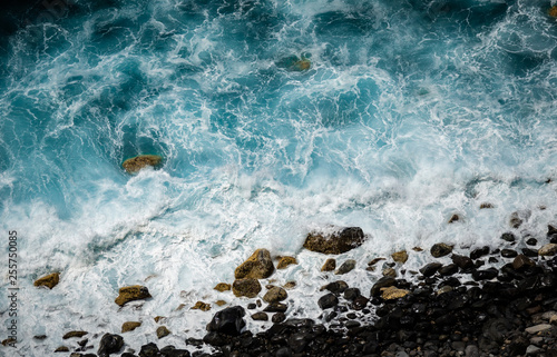 Waves splashing at the shore of Flores island, the Azores.