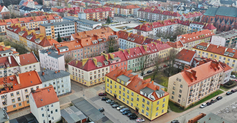 Aerial view on old town center with City Hall, Cathedral and red roof tenements buildings.