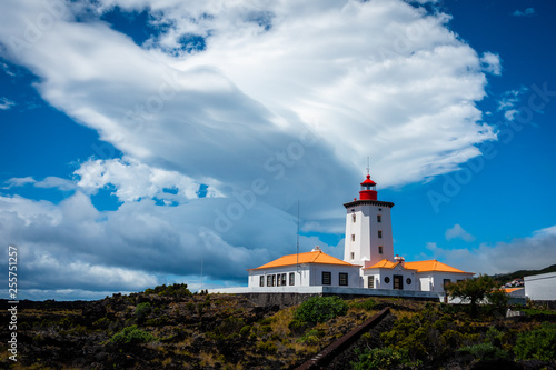 beautiful lenticular cloud above a lighthouse on the island of Pico  the Azores