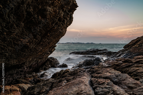 Rocks and sea after sunset photo