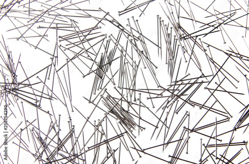 Sewing needles on a white background isolation, top view Sewing needles on a white background isolation, top view