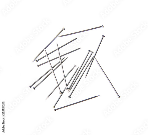 Sewing needles on a white background isolation, top view
