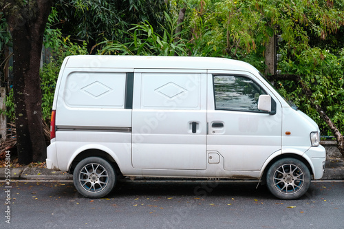 White mini van parking with nature background