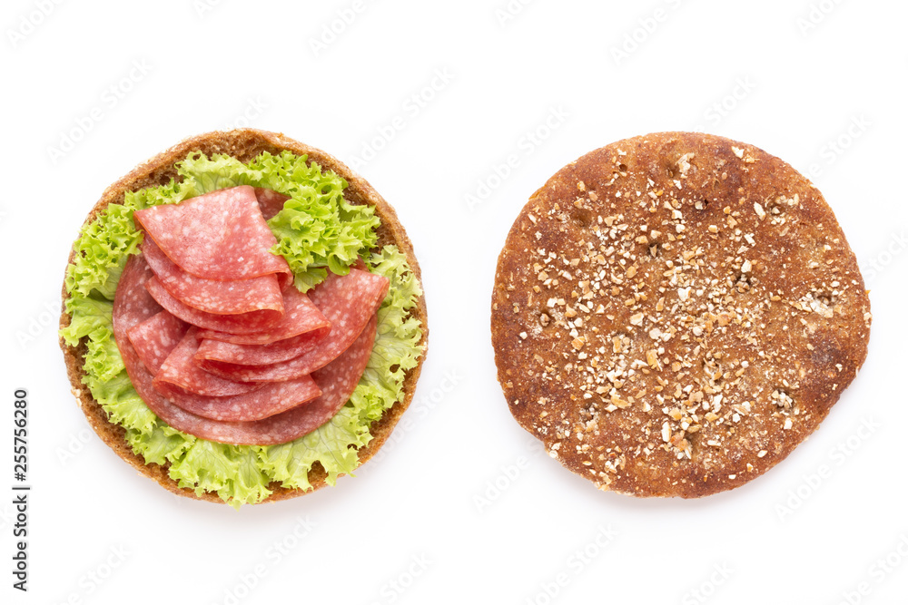 Sandwich with salami sausage on white background.