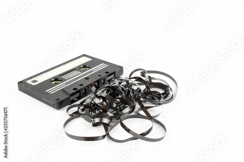 old vintage and compact cassette with the tape sticking out