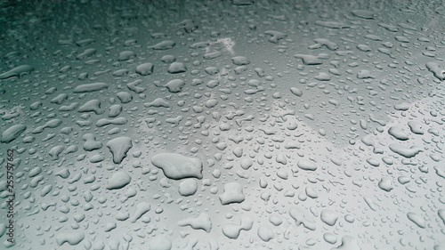 Close-up of water droplets on metal surface as background