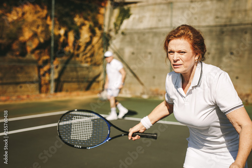 Senior woman playing tennis © Jacob Lund