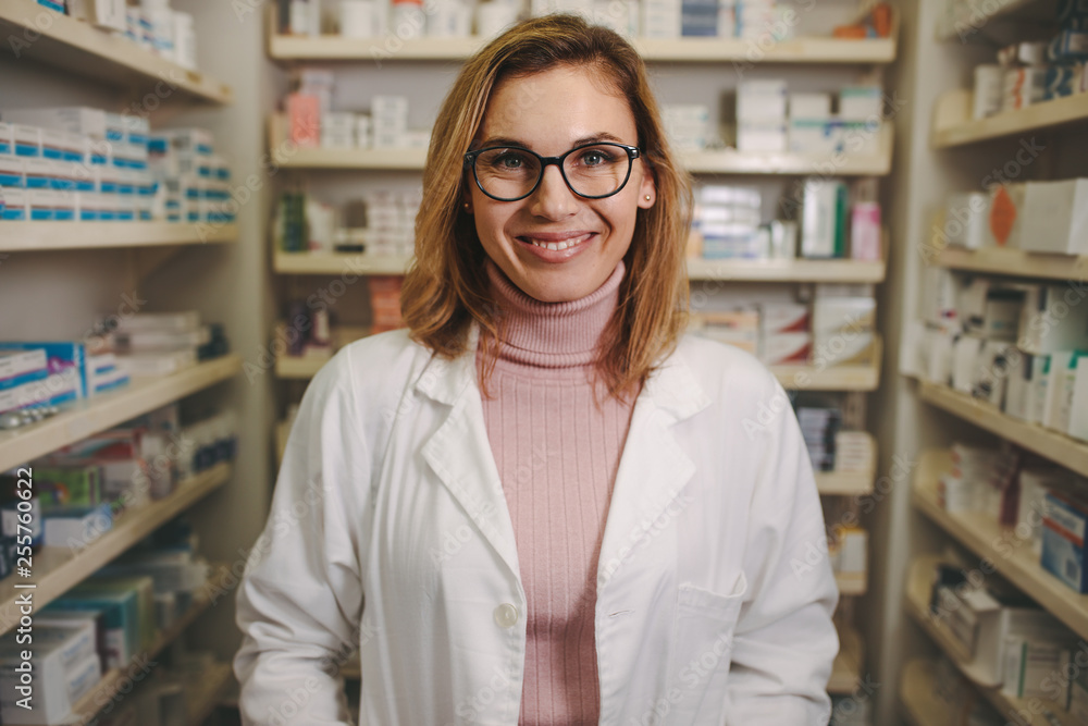 Confident female pharmacist on drug store Confident female pharmacist on drug store