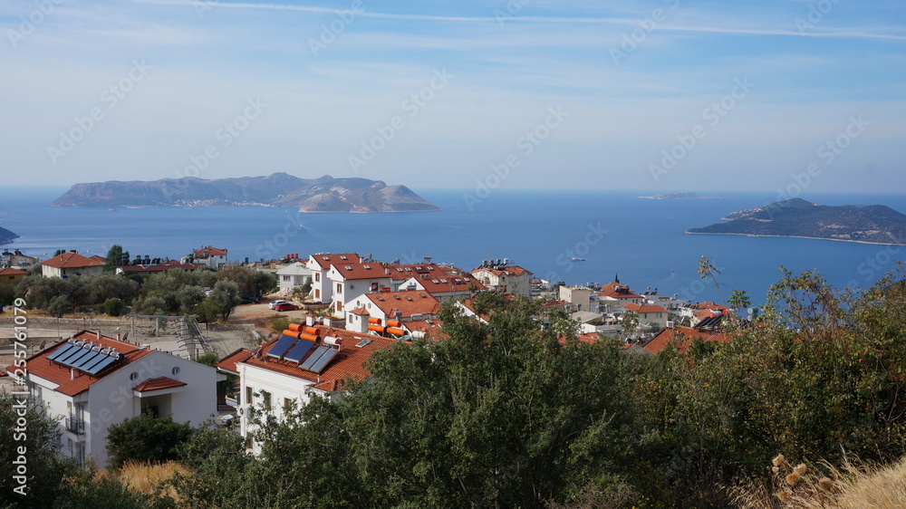 View over the sea and a town from a mountain above