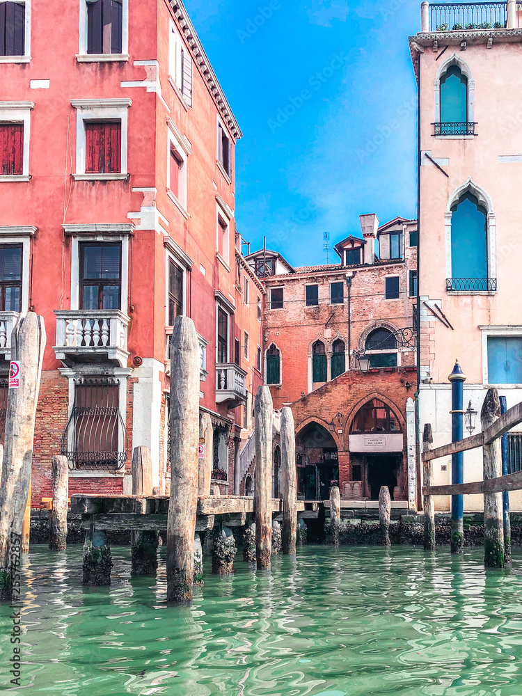 Small romantic canal, old buildings and traditional venetian houses