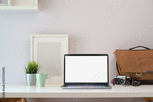 Loft white wood office desk table with laptop and photographer supplies © bongkarn