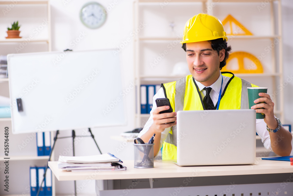 Male construction engineer working in the office Male construction engineer working in the office